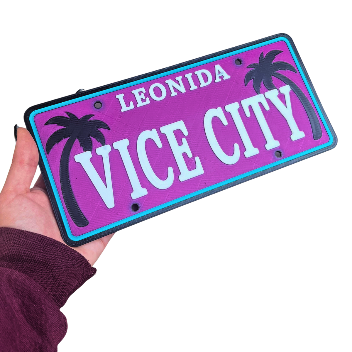 Detalle del cartel decorativo Beetle Print Vice City mostrando el relieve 3D y los colores rosa y azul