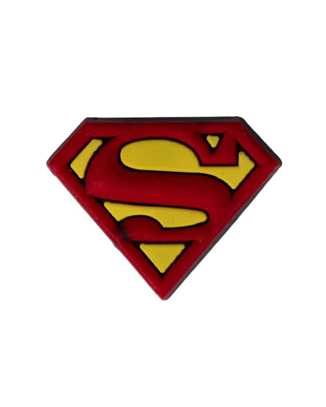 Charm de silicona con diseño del logotipo de Superman.