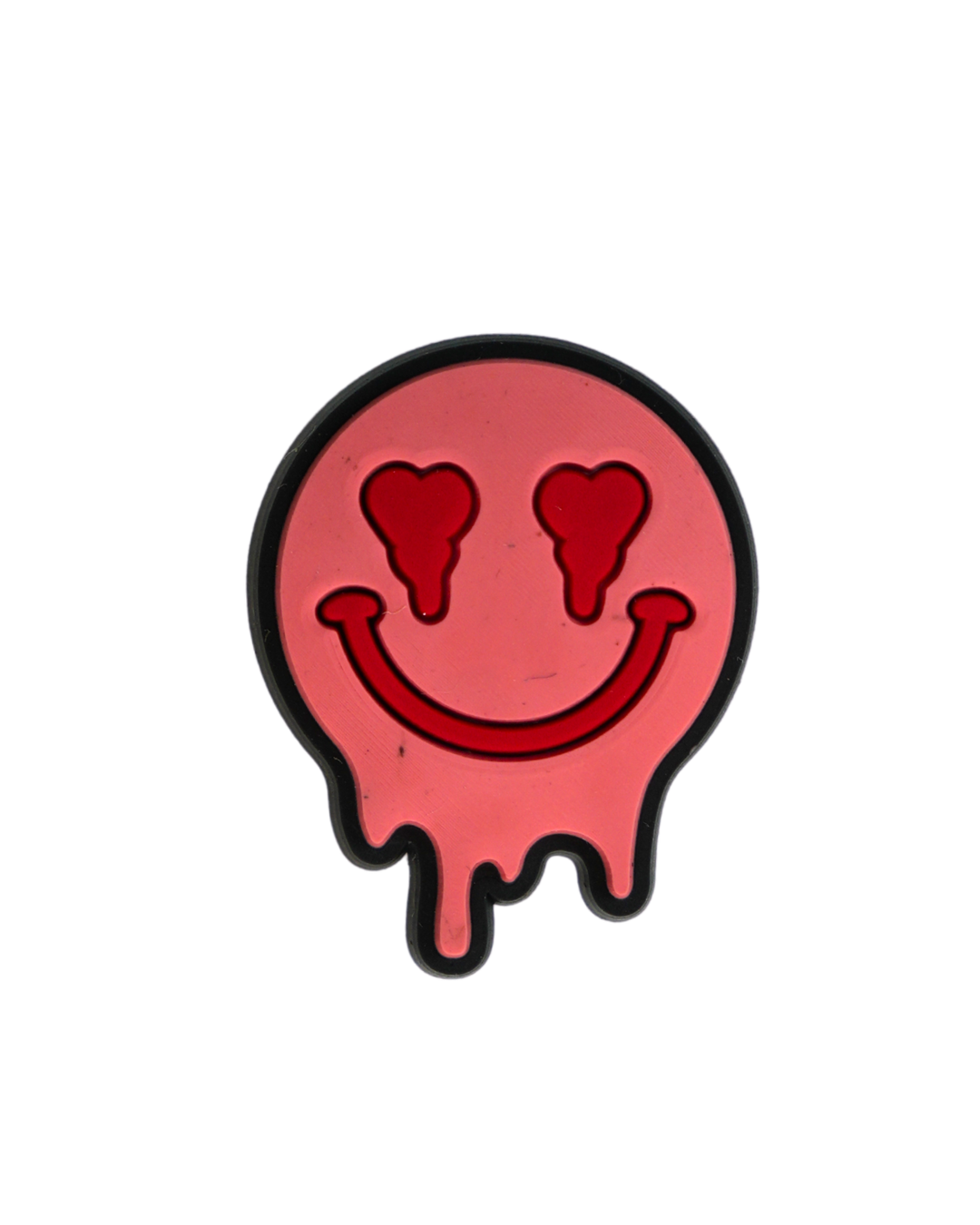 Charm de silicona Beetle Print con diseño de cara sonriente rosa.