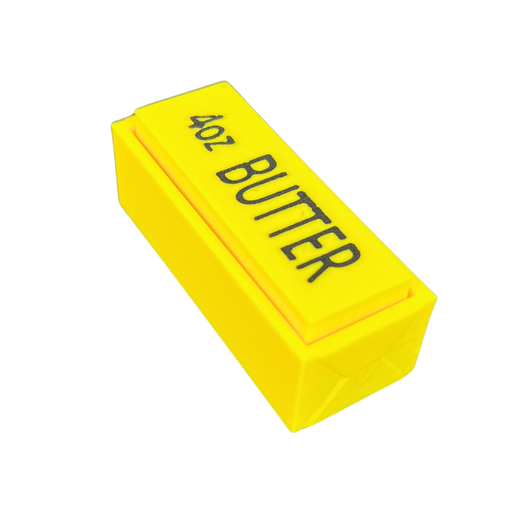 Fidget antiestrés Clicker Butter Beetle Print amarillo fabricado en 3D con diseño inspirado en una barra de mantequilla