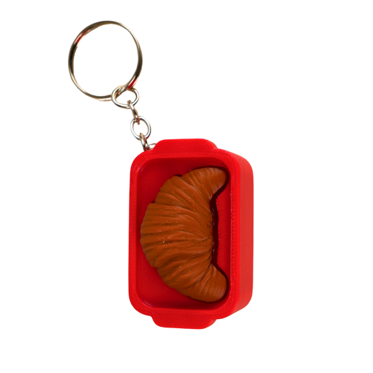 llavero antiestrés beetle print croissant vista lateral dentro de caja diseño compacto