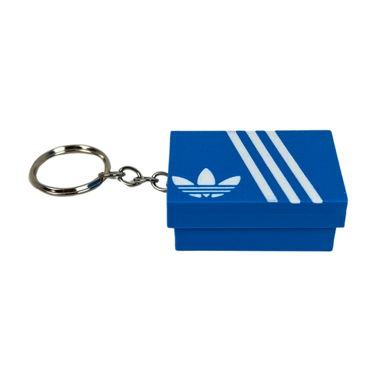 Llavero clicker Beetle Print con diseño de caja de zapatillas azul y franjas blancas, modelo Retro Stripes en vista principal