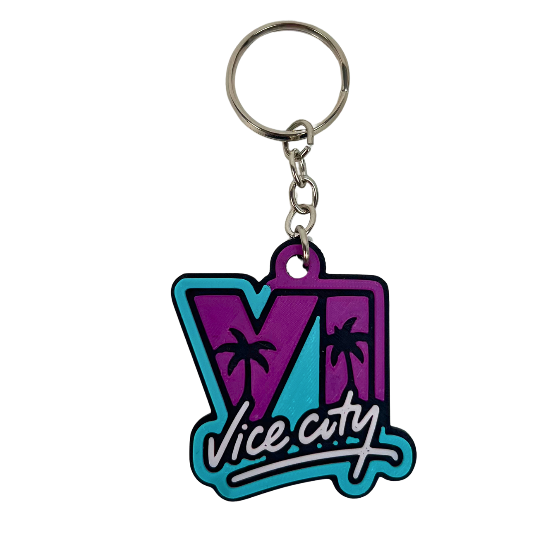 Vista frontal del llavero Vice City 3D Beetle Print morado y turquesa con estilo retro inspirado en ambiente tropical