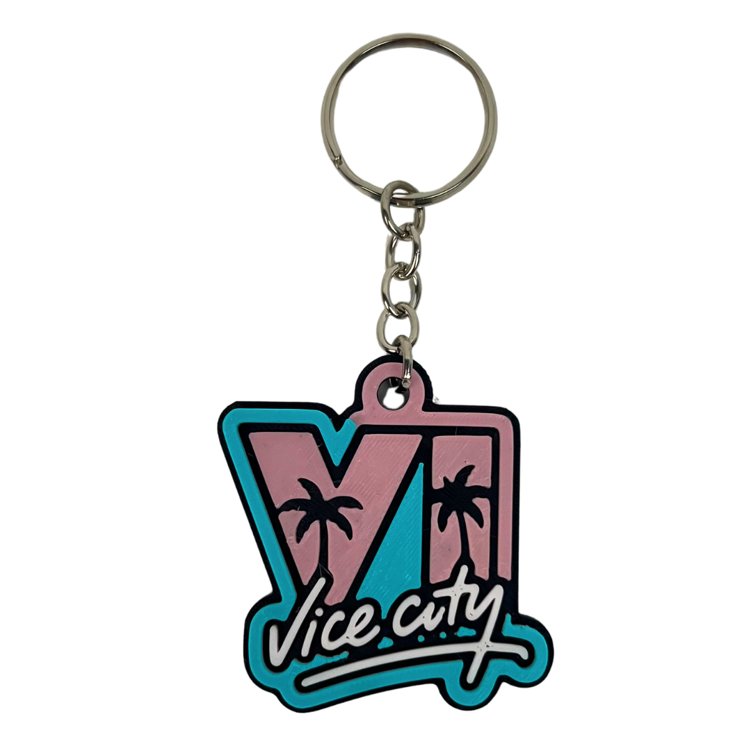 Detalle del llavero Vice City 3D Beetle Print en tonos rosa y turquesa mostrando el relieve del diseño