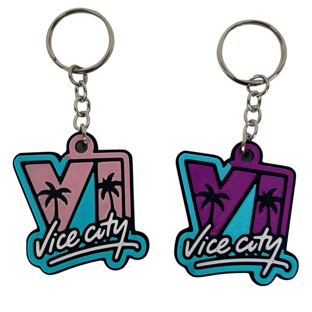 Llavero Vice City 3D Beetle Print rosa y turquesa mostrado de frente con letras en relieve y palmeras decorativas