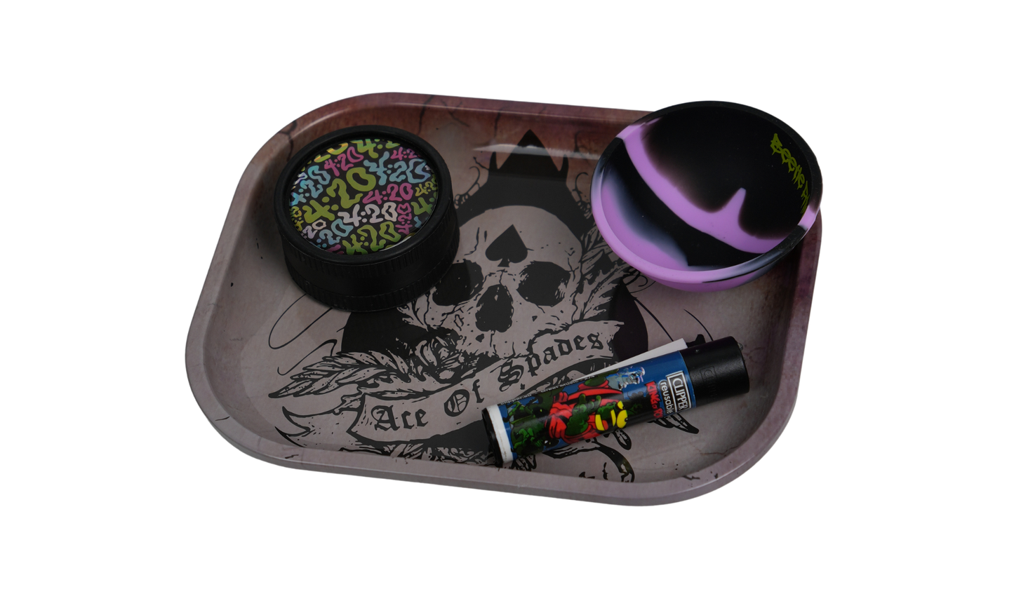 Detail of metal rolling tray showing skull and wings artwork