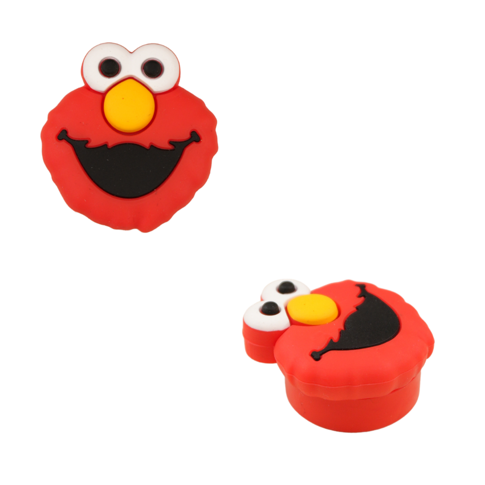 Contenedor wax de silicona rojo con diseño de monstruo sonriente visto desde diferentes ángulos.