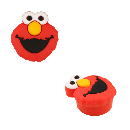 Contenedor wax de silicona rojo con diseño de monstruo sonriente visto desde diferentes ángulos.