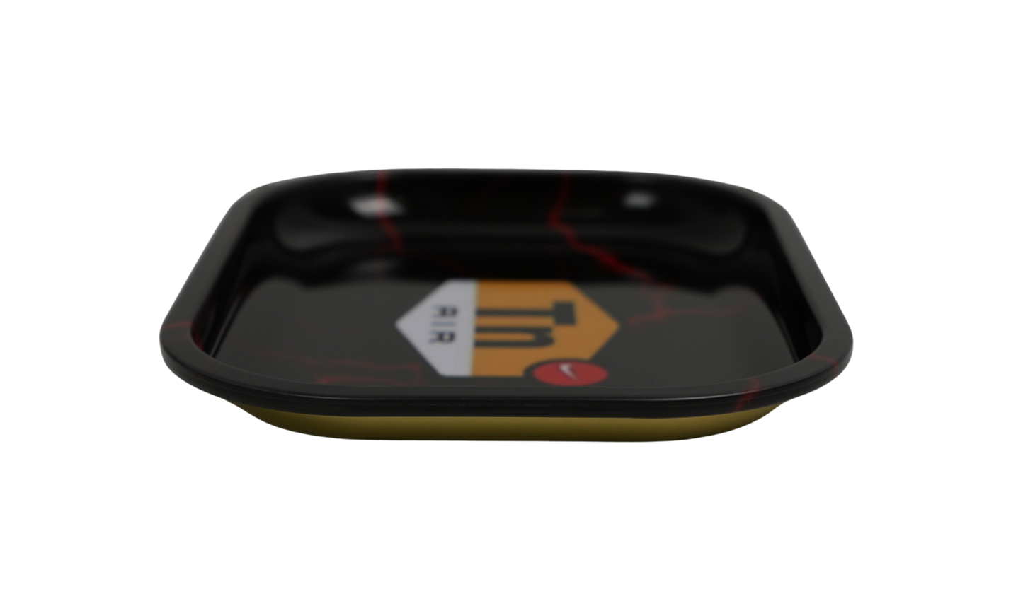 Angled view of glossy black metal rolling tray