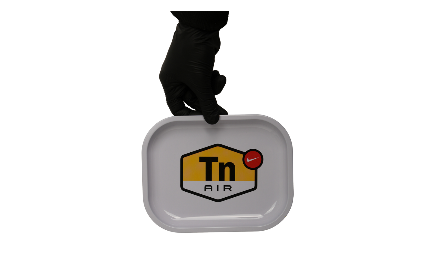 Top view of white metal rolling tray with graphic signal design