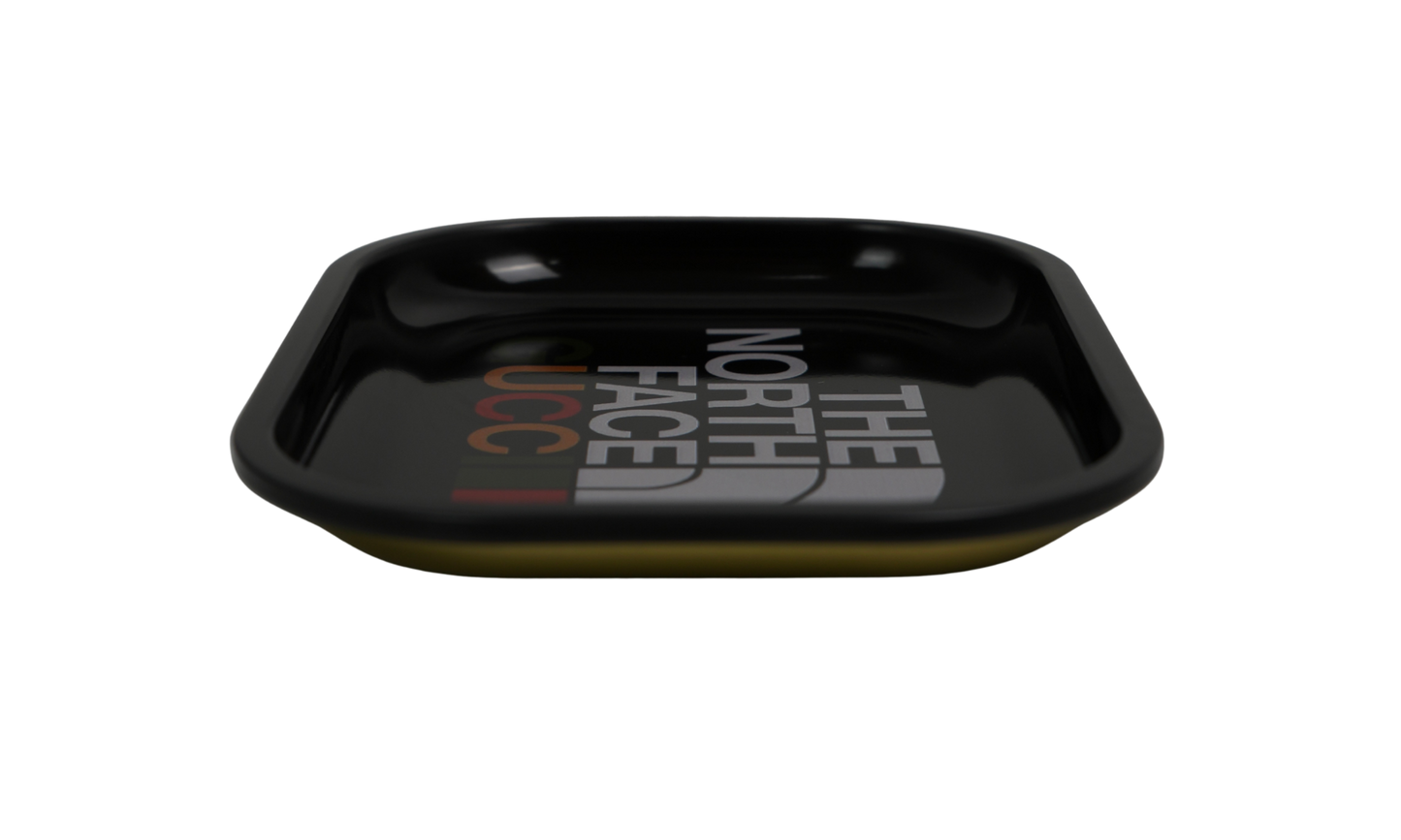 Angled view of black metal rolling tray with glossy finish
