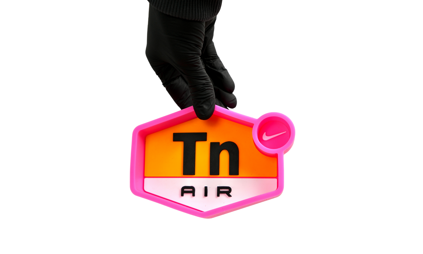 Pink silicone ashtray in use 
