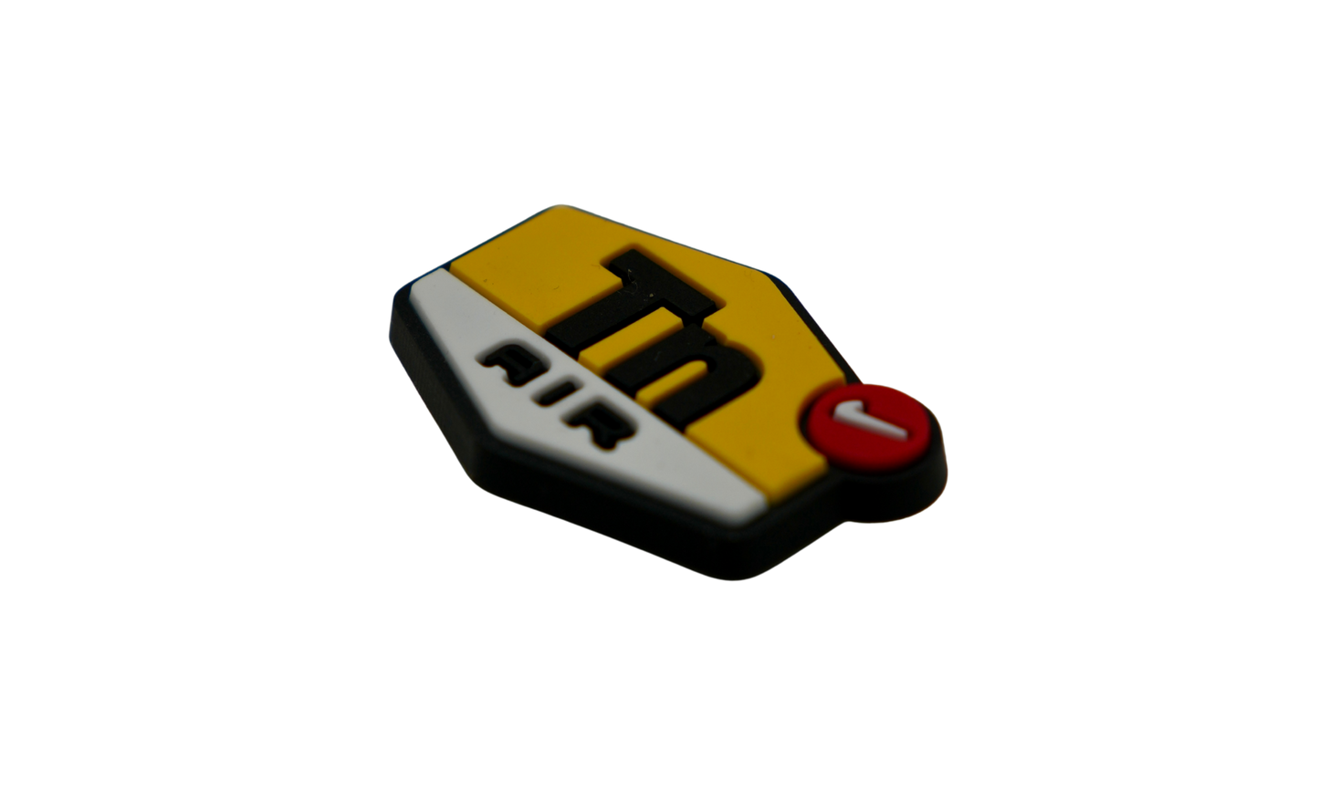 Detail of silicone shoe charm logo and texture