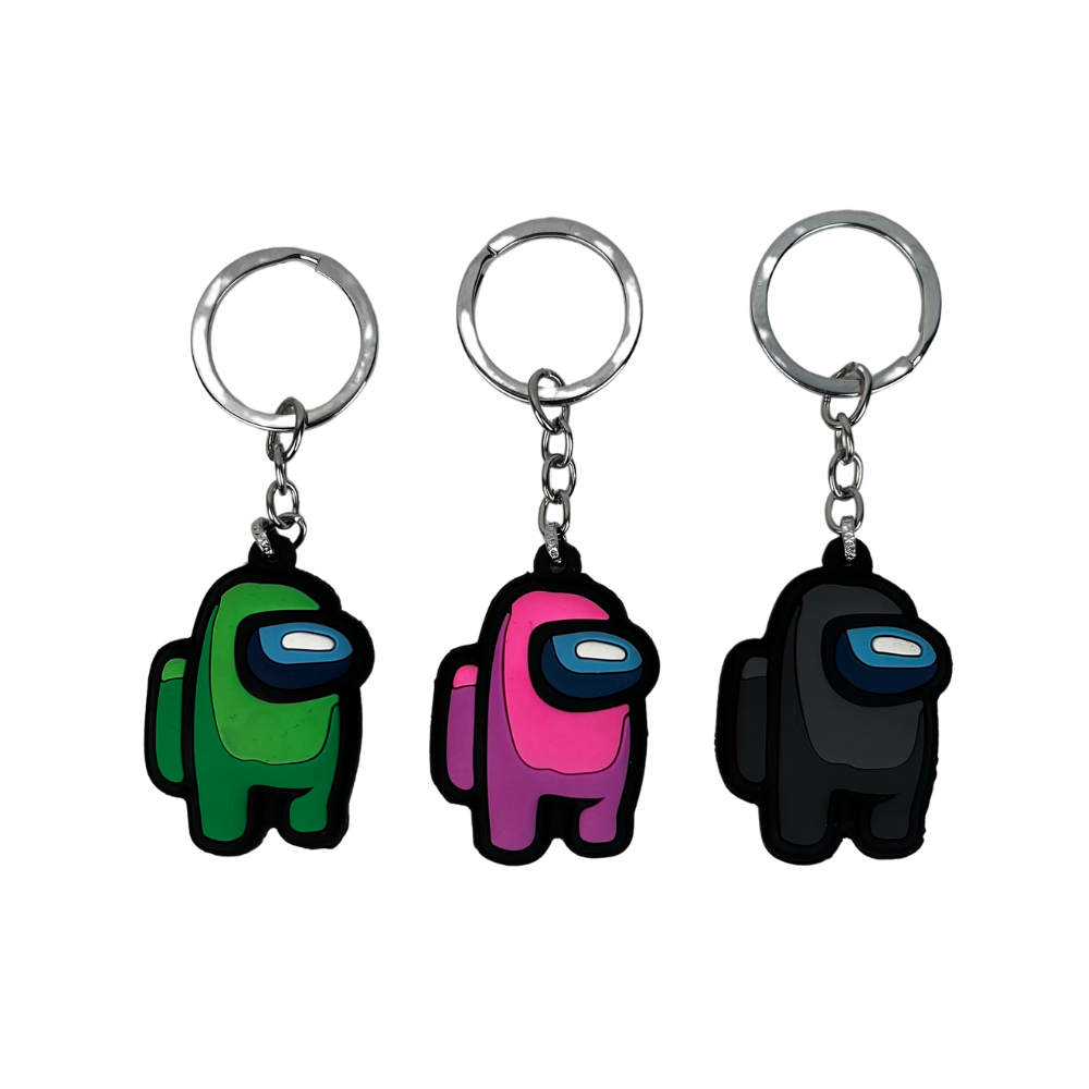 Pack de 3 llaveros de silicona con personaje espacial estilo cartoon en verde rosa y negro