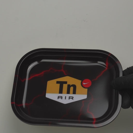 Video showcasing black metal rolling tray with DIR lightning graphic design