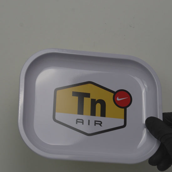 Video showcasing metal rolling tray with minimal DIR signal graphic design