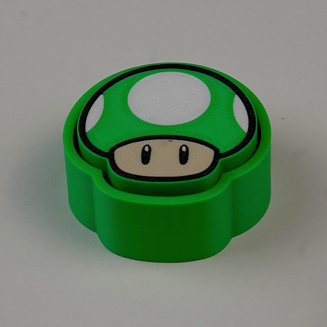 fidget antiestrés beetle print seta gaming retro en uso presionando boton clicker