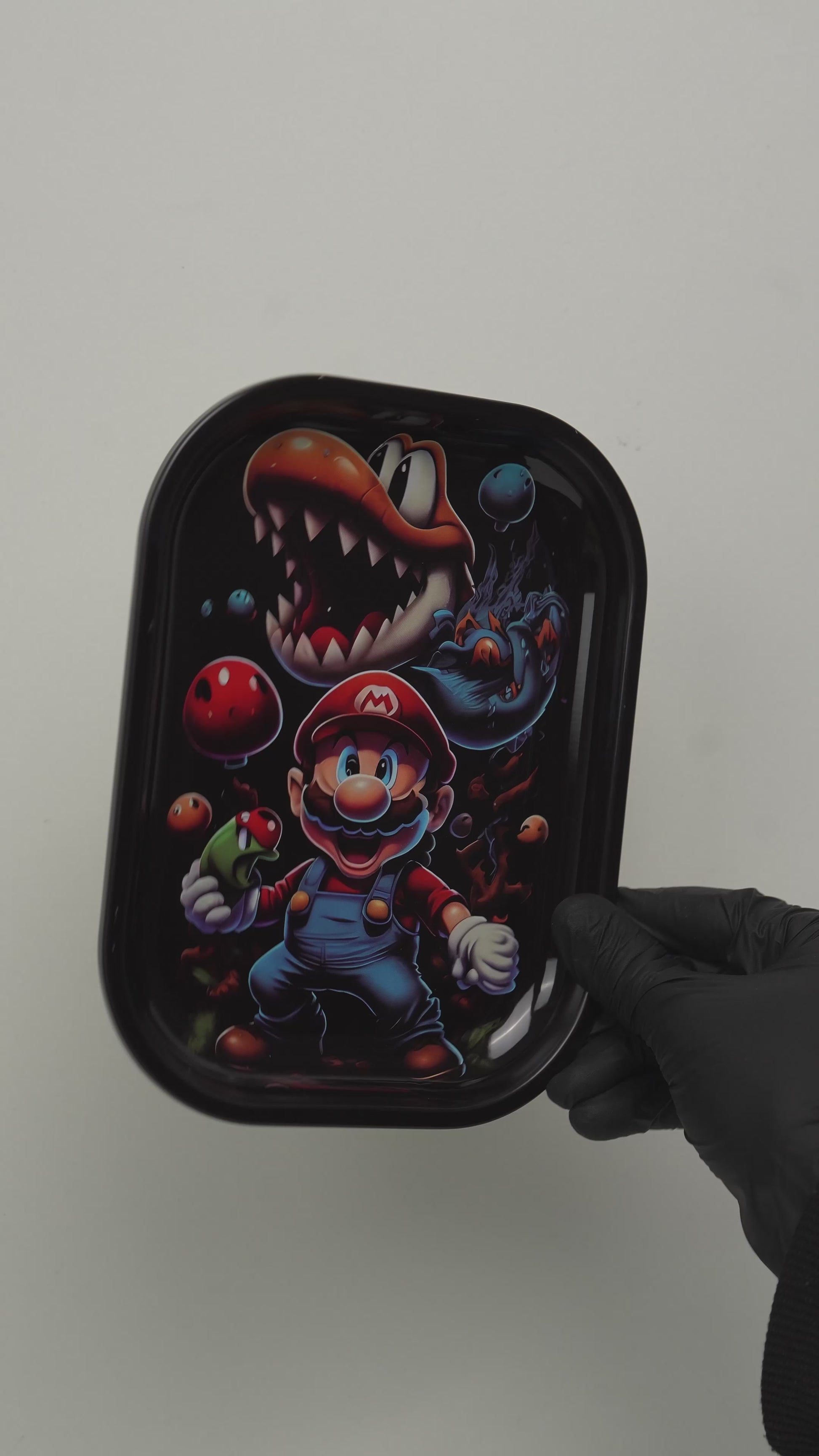 Video showing metal rolling tray with retro fantasy cartoon design, rotating view and real size
