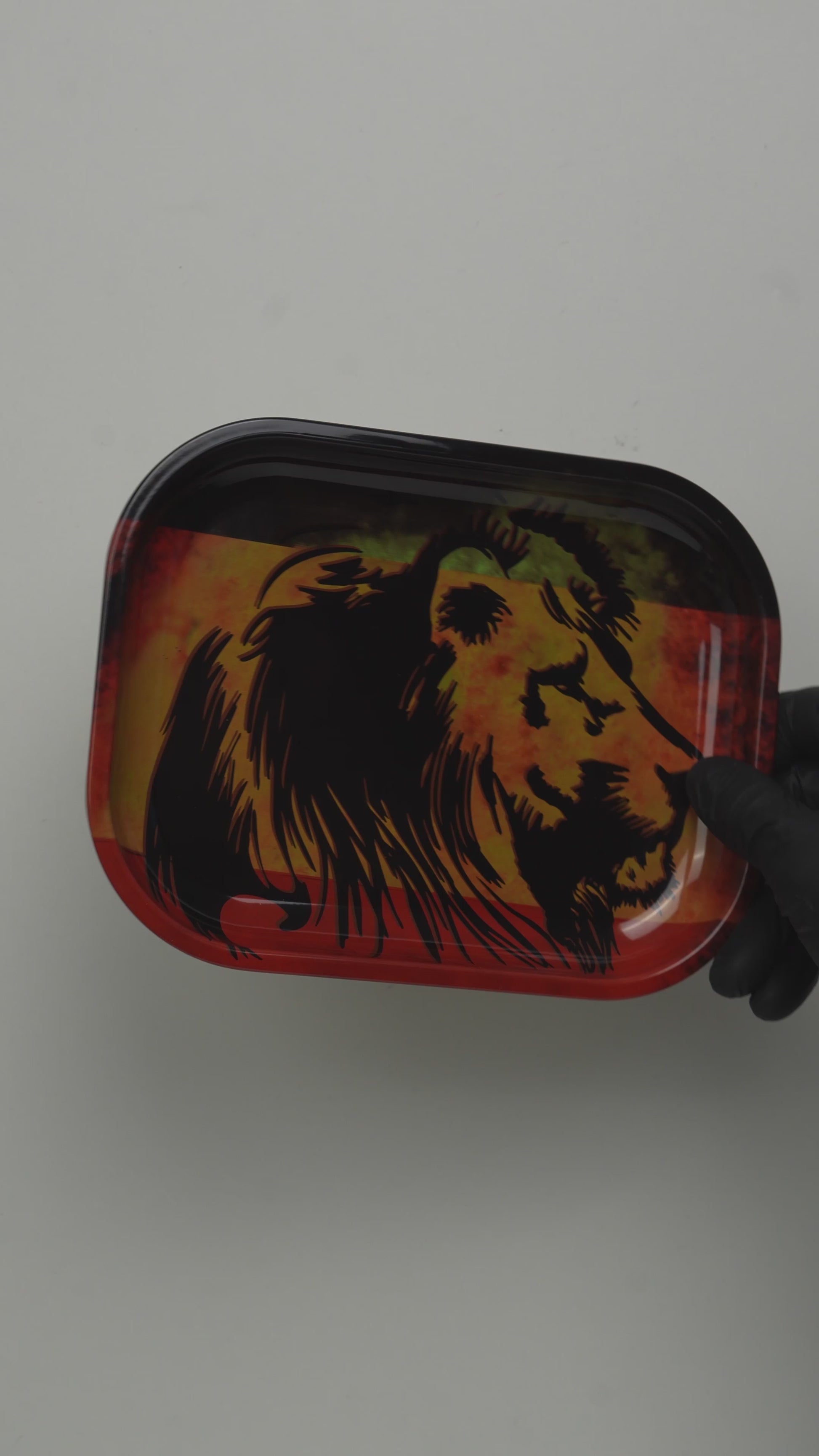 Video showcasing metal rolling tray with lion fire design and glossy finish