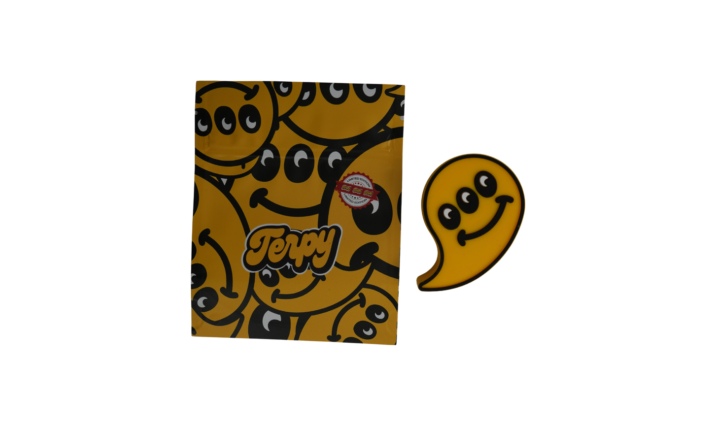 Packaging Terpy con diseño smiley amarillo y pegatina de silicona en forma de fantasma amarillo.